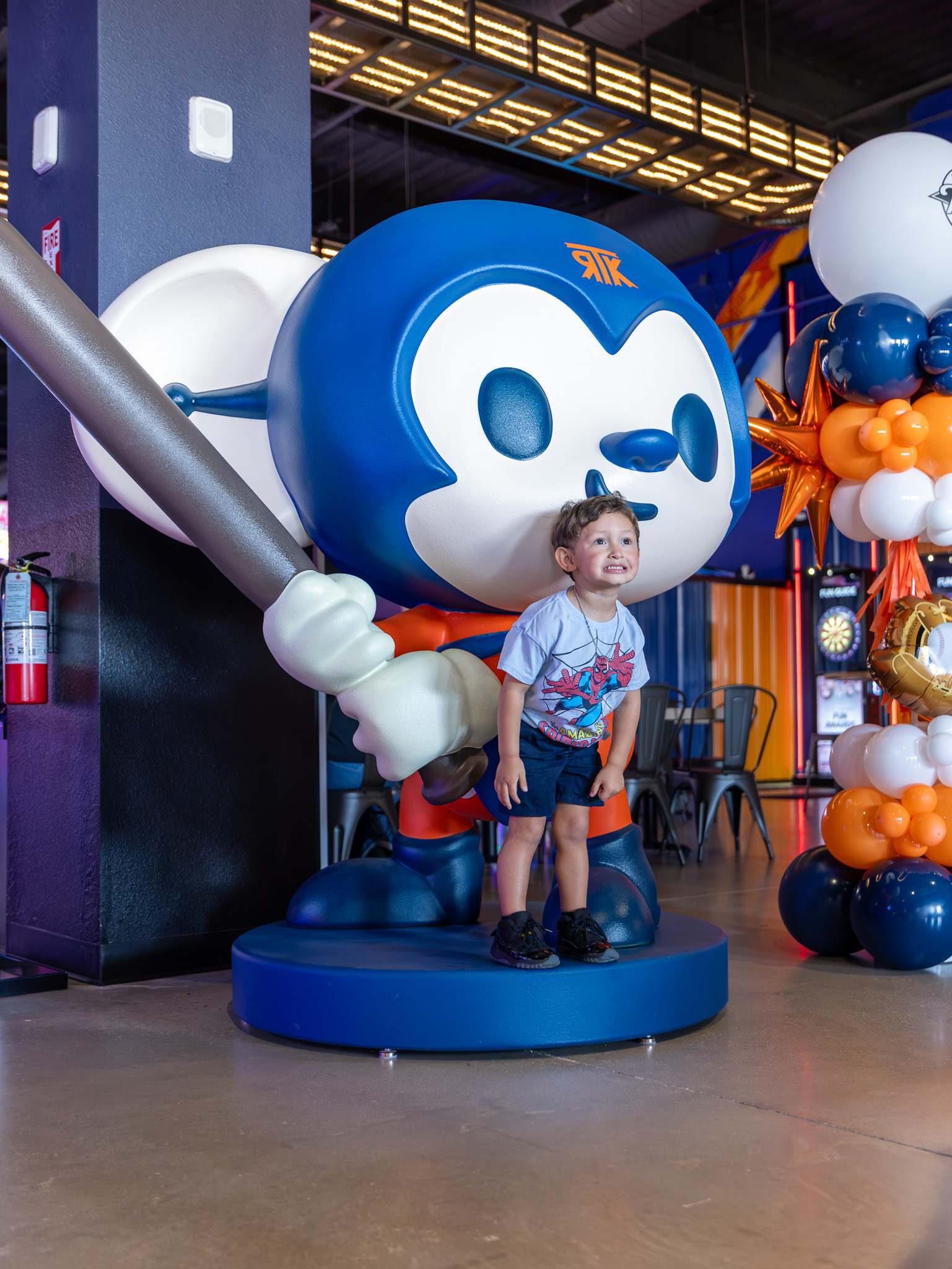 A young guest with the Taroko mascot at the San Antonio grand opening